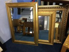 Three gilt framed mirrors