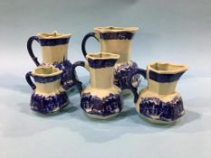 Set of five graduated jugs