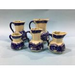 Set of five graduated jugs