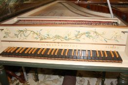 A harpsichord by Colin Booth, with dark green outer case and brass hinges, the lid opening to reveal