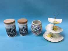 A Poole pottery vase, two Portmeirion storage jars and a 'Citrone' Sandland ware three tier cake