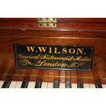 A mahogany square piano by W. Wilson of London, with cross banded case, decorative fretwork and
