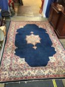 A blue ground Persian design rug, 270 x 183cm