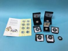Six silver proof coins, two silver 50ps etc.
