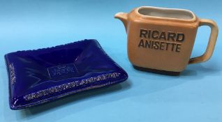 A pottery 'Cognac' shallow dish and a 'Ricard Anisette' water jug (2)