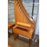 An electric action oak cased organ. 83cm wide x 187 height