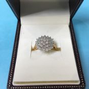 A 9ct gold diamond cluster ring, size 'P', 4.7 grams