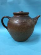 A very large earthenware pottery brown glazed teapot, 36cm height x 53cm wide