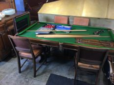 An oak Riley's snooker/ dining table with slate bed, to include a boxed Riley's set of snooker