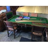 An oak Riley's snooker/ dining table with slate bed, to include a boxed Riley's set of snooker