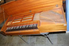 A walnut cased Clavichord by Robert Morley of London, numbered 1030 (no stand). 132cm length, 47cm