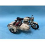 A metalwork model of a motorbike and sidecar