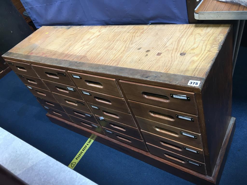 A haberdashery style chest with twenty small drawers, 120cm wide x 84cm height