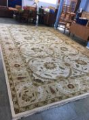 A very large beige pattern carpet square, 18ft x 12ft