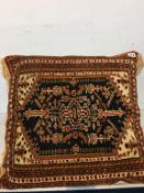 Persian rug covered cushion