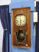 An Art Deco wall clock, with octagonal silvered dial