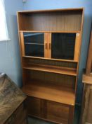 A teak display cabinet