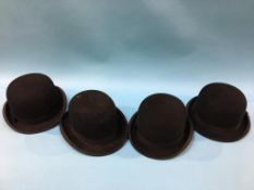 Four bowler hats