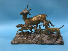 A Continental brass group of a stag being hunted by dogs, stamped 'Fratin', 38cm wide