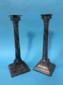 A pair of silver plated Corinthian column candlesticks, 33cm height