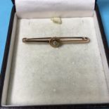 A 9ct gold and diamond bar brooch