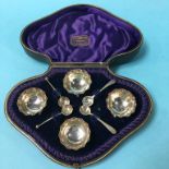 Four silver salts, in fitted case