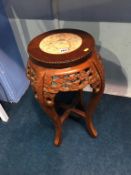 Oriental hardwood plant stand, with inset marble top, 62cm height
