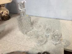 A cut glass whiskey decanter and five glasses