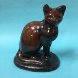 A 19th century pottery treacle glaze 'Canny Hill' cat, 29cm height