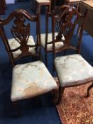 A set of four Edwardian mahogany chairs