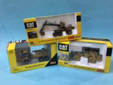 Three boxed 'CAT' vehicles