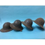 Four 2nd World War tin military helmets