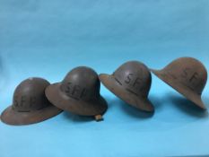 Four 2nd World War tin military helmets