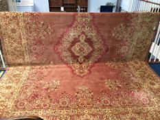 A large patterned pink ground carpet square, 300 x 400cm (approx.)