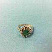 A 9ct gold green stone ring, size 'Q'