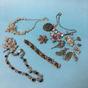 A collection of costume jewellery, brooches etc.