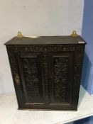 An antique carved oak spice cupboard, 48cm wide, 55cm height