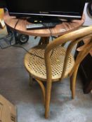 A Bentwood style table and two chairs