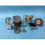 Assorted silver to include a condiment, cream jug and match striker etc.