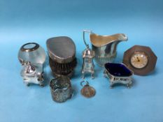 Assorted silver to include a condiment, cream jug and match striker etc.