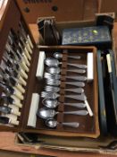 Assorted cutlery and a metronome