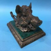 A brass inkwell, modelled as a Boars head