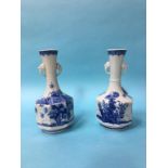 A pair of blue and white Oriental vases