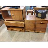 Two teak cabinets and a pair of bedside drawers