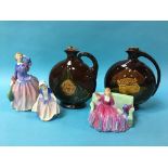 Three Royal Doulton figures and a pair of Royal Doulton Dewar's Whiskey decanters