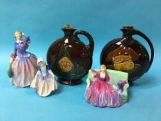 Three Royal Doulton figures and a pair of Royal Doulton Dewar's Whiskey decanters