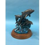A cast metal figure group of Dolphins