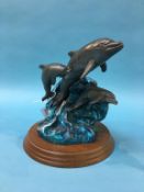 A cast metal figure group of Dolphins