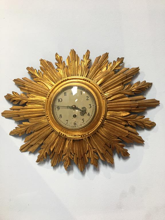 A Sunburst giltwood wall clock