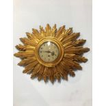 A Sunburst giltwood wall clock